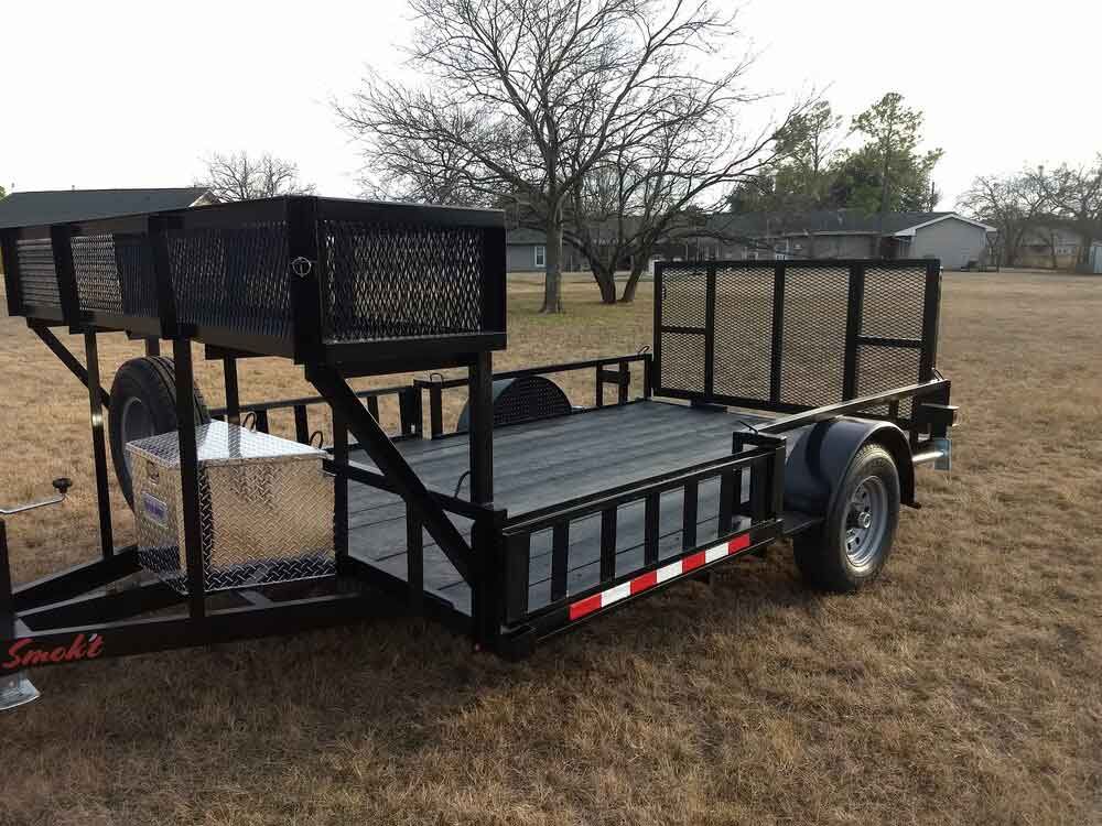 Single axle custom utility trailer with mesh sides and ramp gate