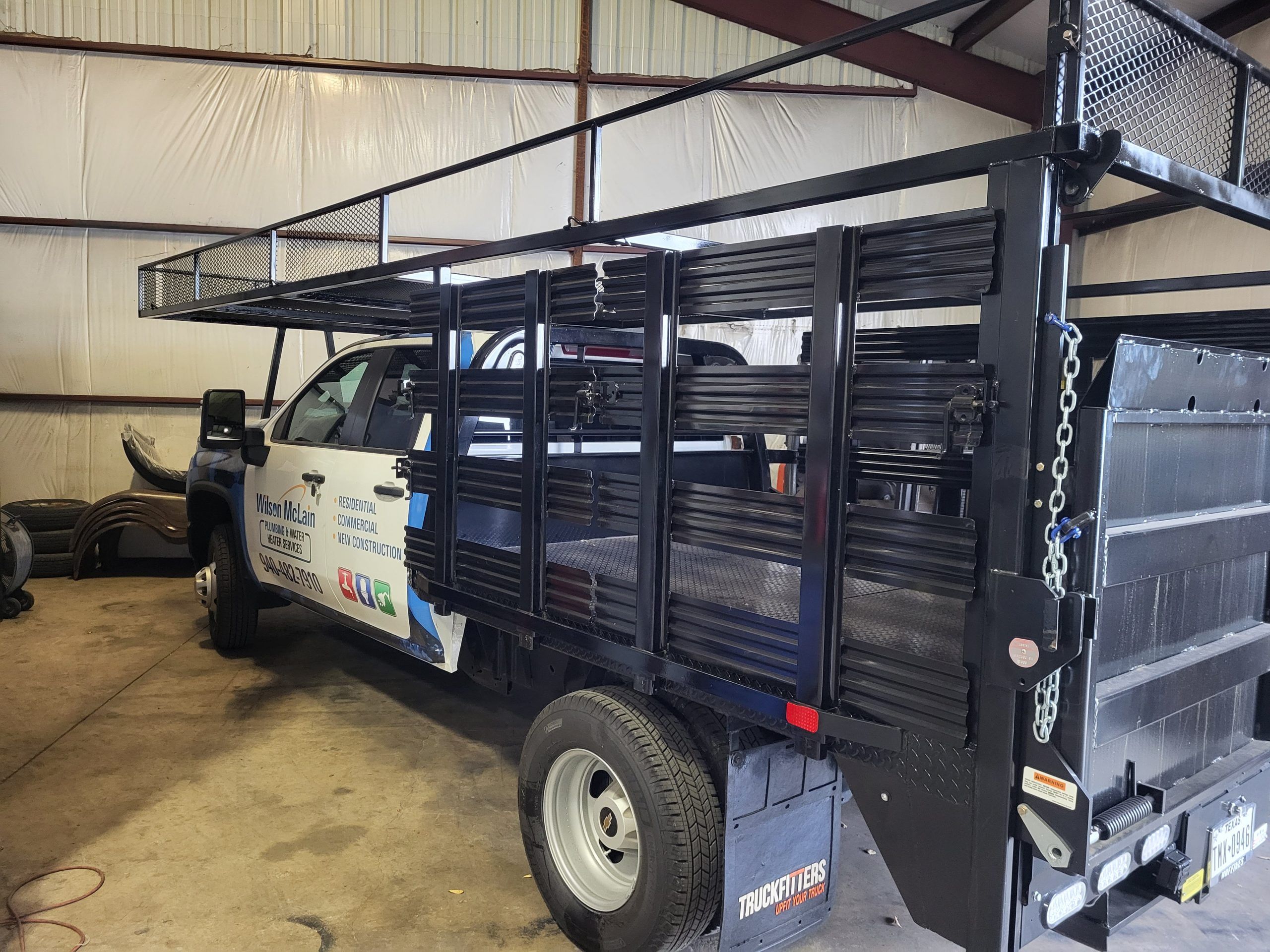 Custom welded flatbed rack on a service truck in the Smok’t shop